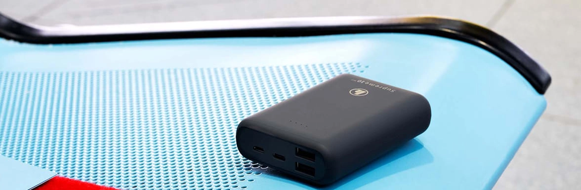 Hama power bank lies on a seat in the airport waiting area.