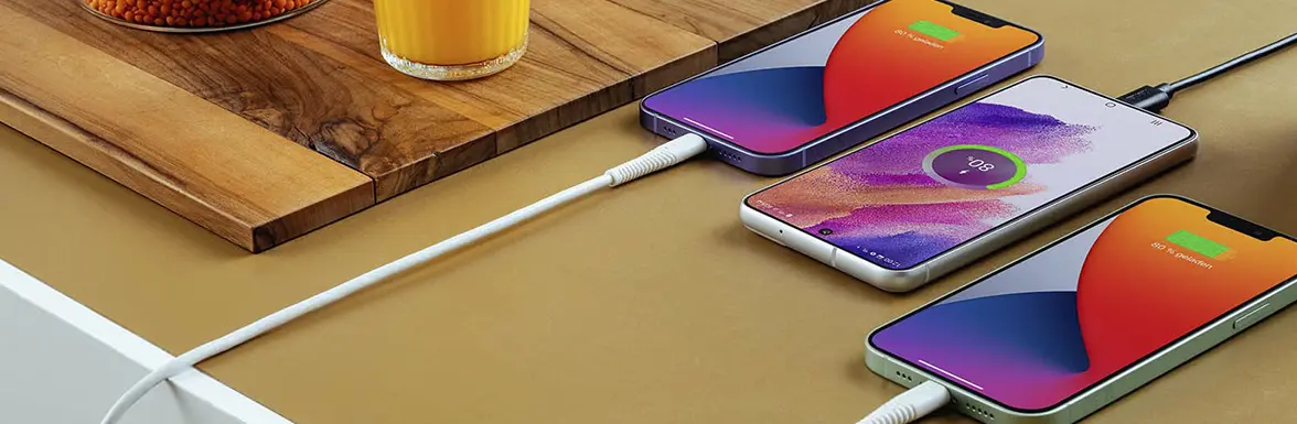 Several phones are on the table and are being charged.