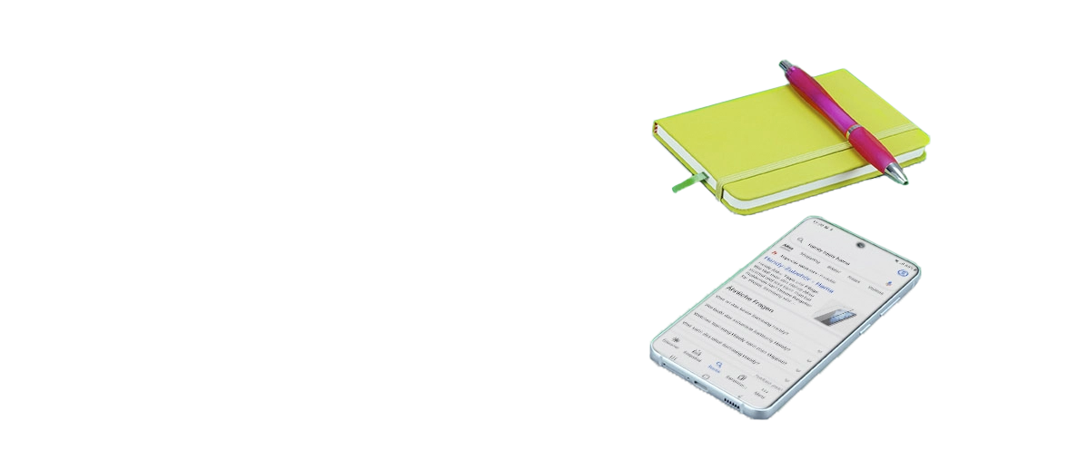 Notepad and mobile phone next to each other.