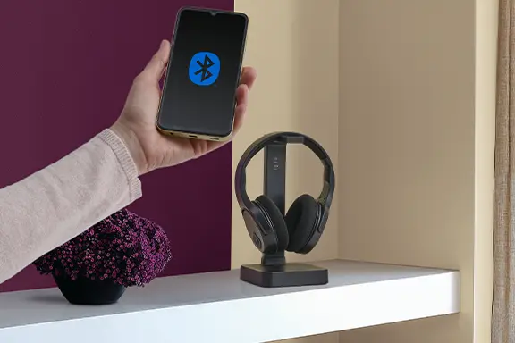 The headphones are connected to the mobile phone.